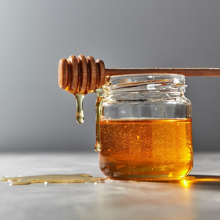 Pure golden honey jar with honey dipper